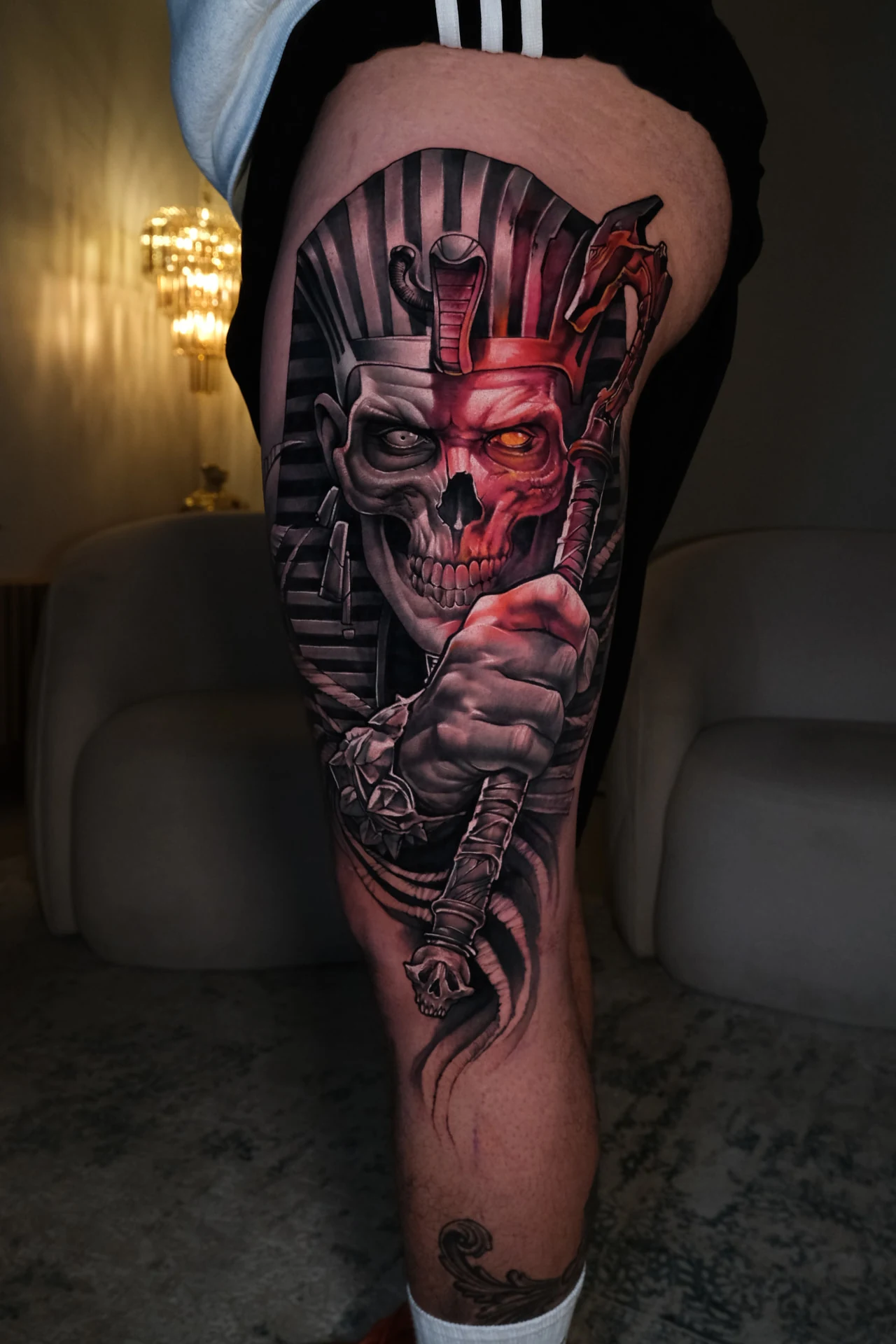 Realistic Egyptian skull tattoo in black and red