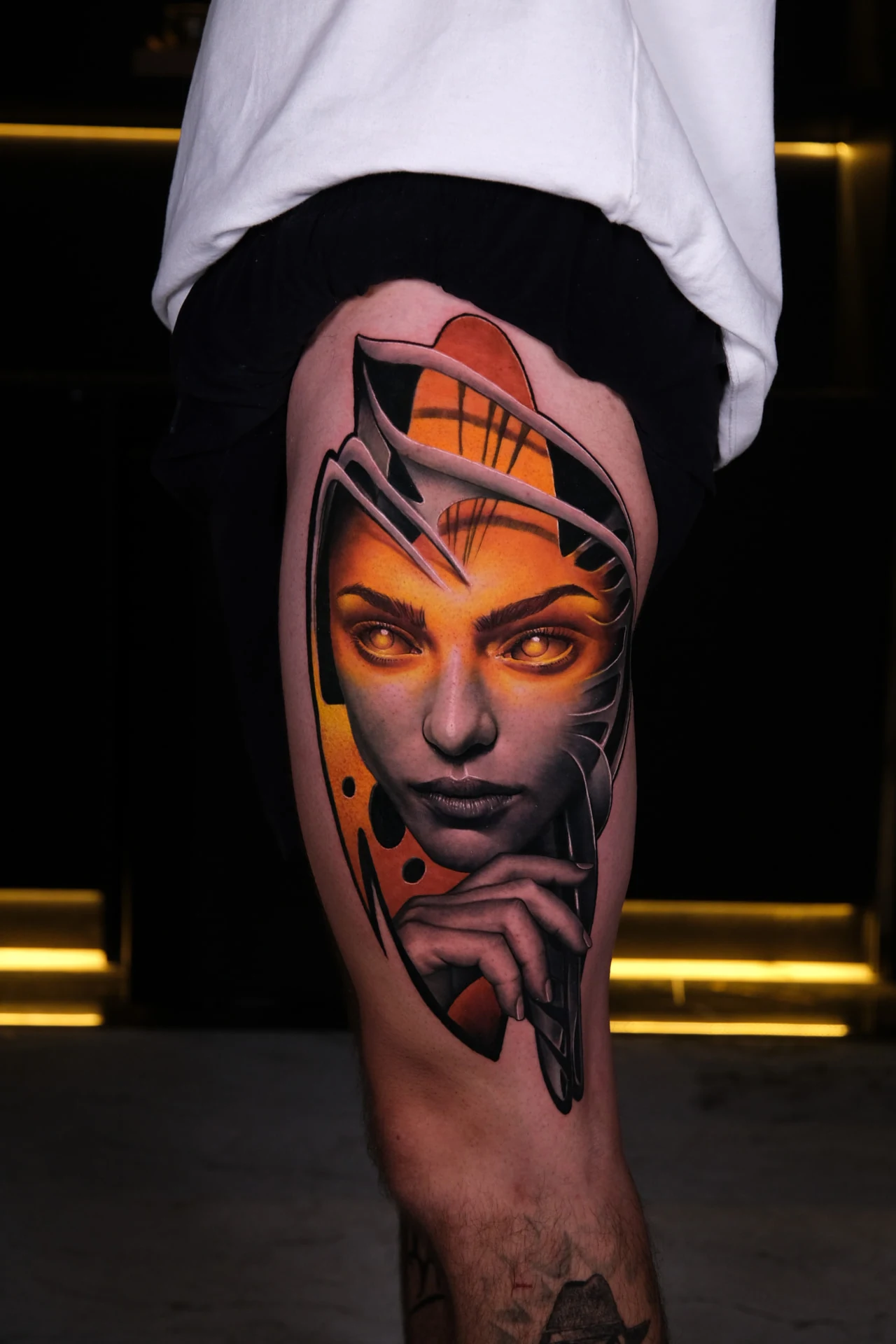 Realistic female portrait in black and orange